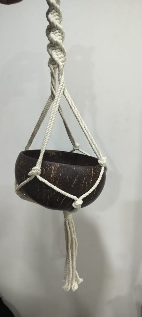 Handcrafted coconut shell bowl in a macramé hanger