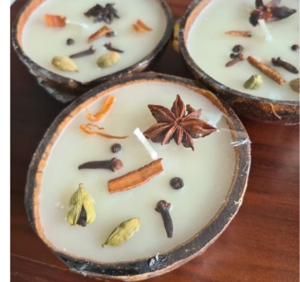 Coconut shell candles finished with whole spices