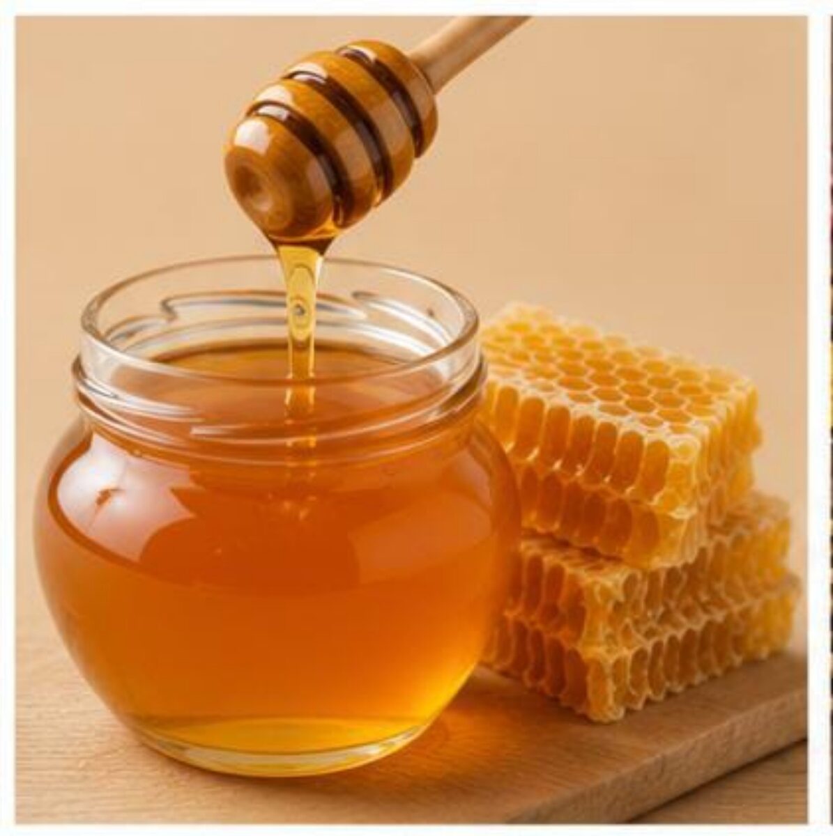 Jar of natural honey with honey dipper